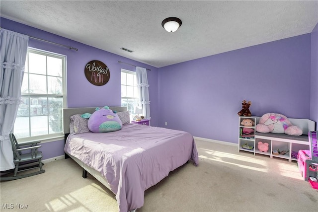 bedroom with multiple windows and carpet floors