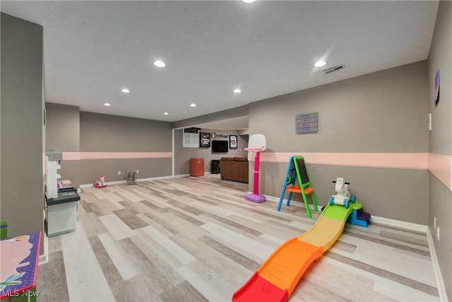 game room featuring light hardwood / wood-style flooring