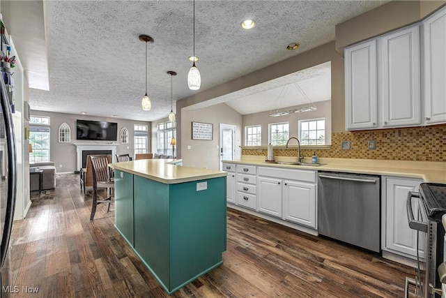 kitchen with white cabinetry, dishwasher, a center island, and sink