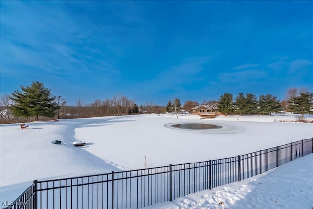 view of yard layered in snow