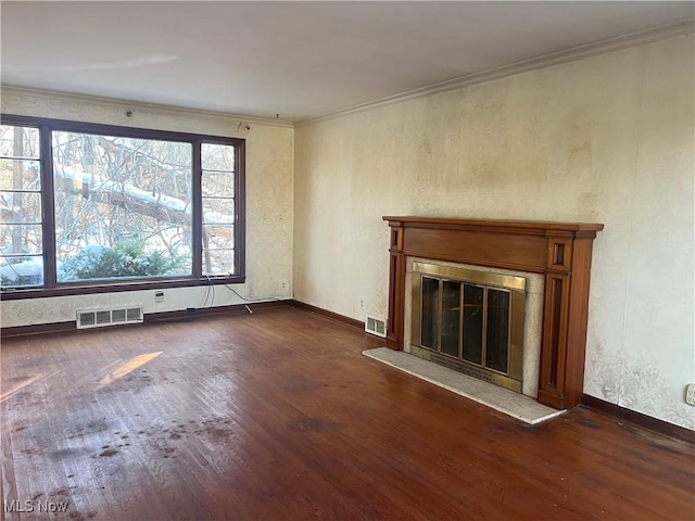 unfurnished living room featuring crown molding and dark hardwood / wood-style flooring