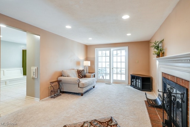 carpeted living room with a textured ceiling