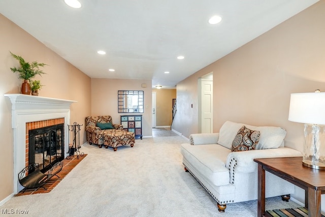 carpeted living room featuring a brick fireplace