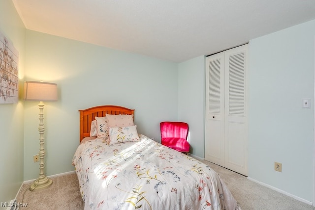 carpeted bedroom with a closet