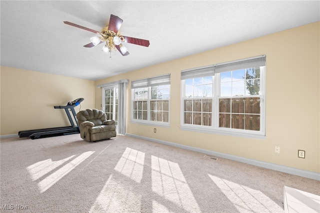 unfurnished room with light carpet and ceiling fan