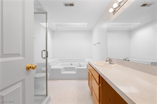 bathroom with vanity, a tub, and toilet