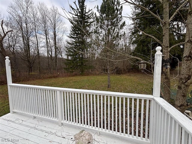 wooden terrace with a yard