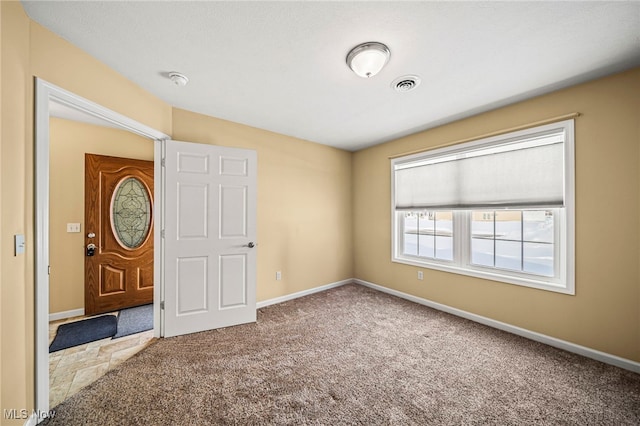 empty room with carpet flooring