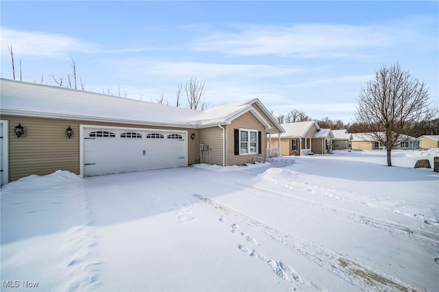 ranch-style house featuring a garage