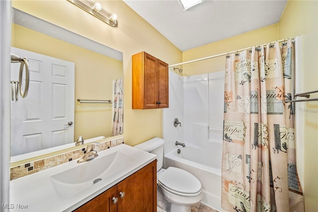 full bathroom featuring vanity, shower / bathtub combination with curtain, and toilet