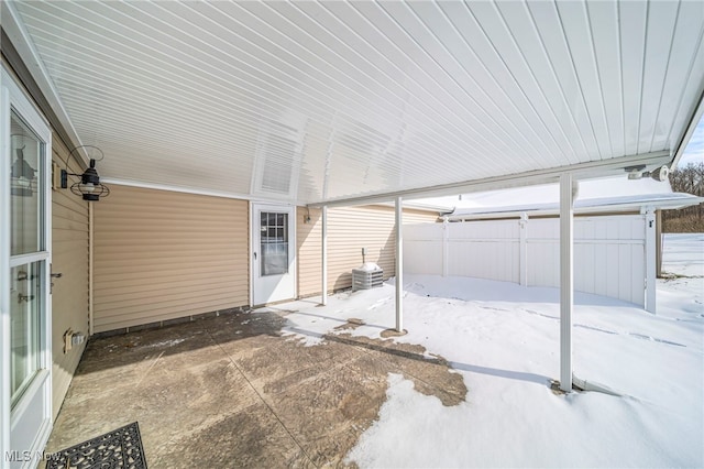 snow covered patio with central AC