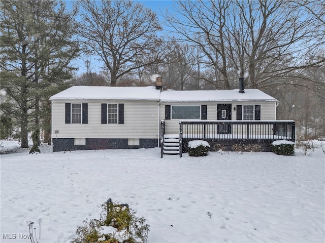 view of front of property with a wooden deck