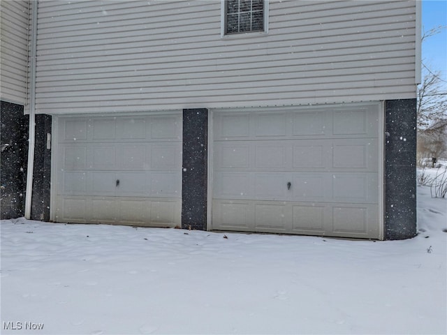 view of snow covered garage