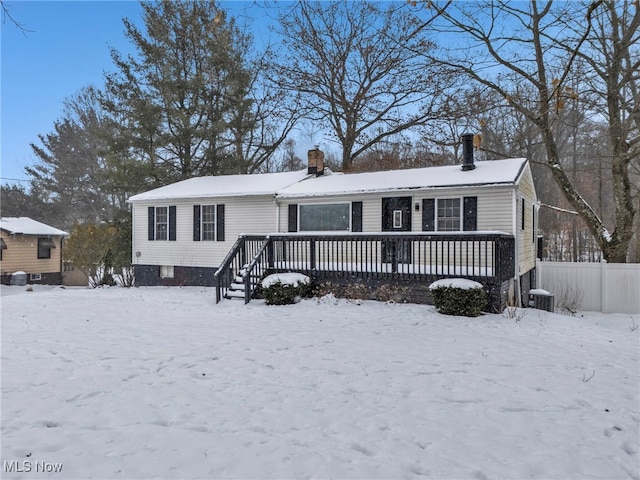 view of front of house featuring a deck and central air condition unit