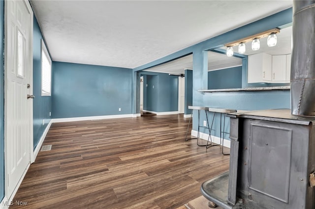 living room with dark hardwood / wood-style flooring