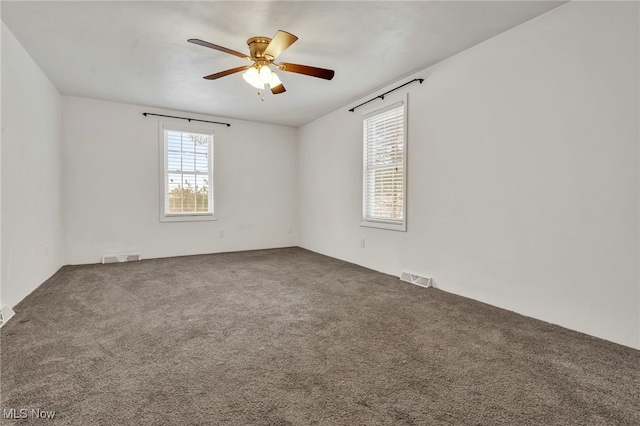 carpeted empty room with ceiling fan