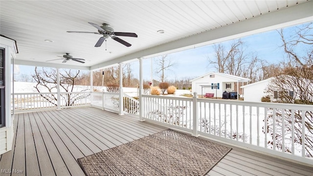 snow covered deck featuring ceiling fan