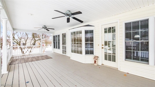 wooden terrace featuring ceiling fan