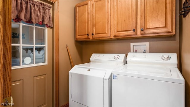 laundry area featuring cabinets and washer and dryer