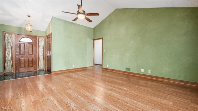 entrance foyer featuring wood-type flooring, high vaulted ceiling, and ceiling fan