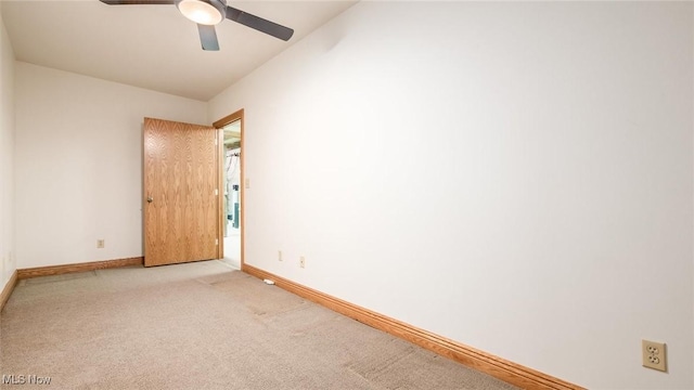 unfurnished room with light carpet and ceiling fan