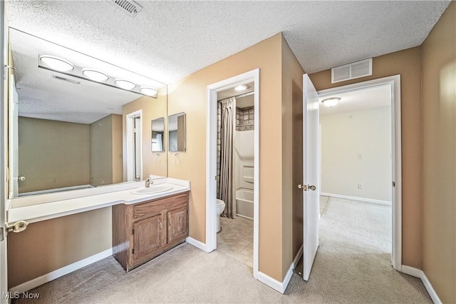 full bathroom featuring vanity, shower / bath combo with shower curtain, a textured ceiling, and toilet