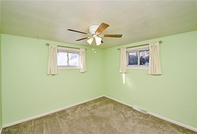 carpeted empty room with ceiling fan