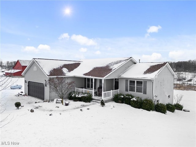 view of front of house featuring a garage and covered porch