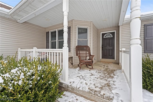 view of snow covered property entrance