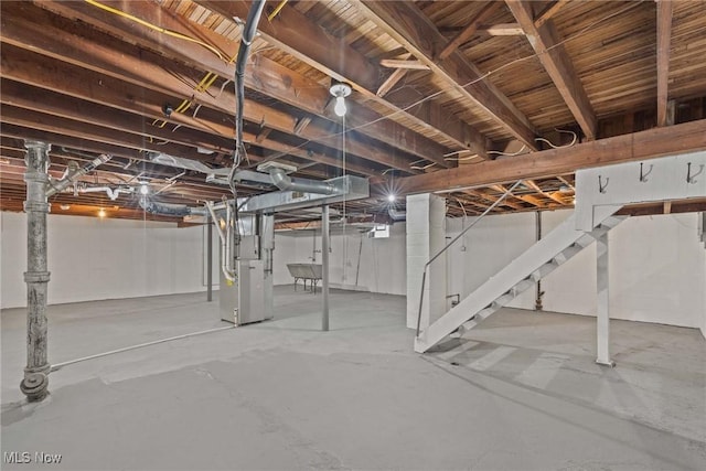 basement with sink and heating unit