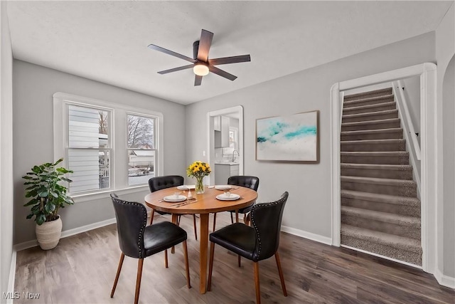 dining area featuring dark hardwood / wood-style floors and ceiling fan