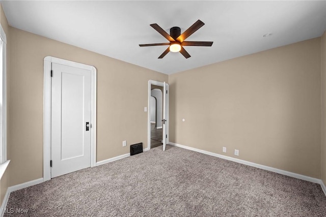 unfurnished bedroom with carpet floors and ceiling fan