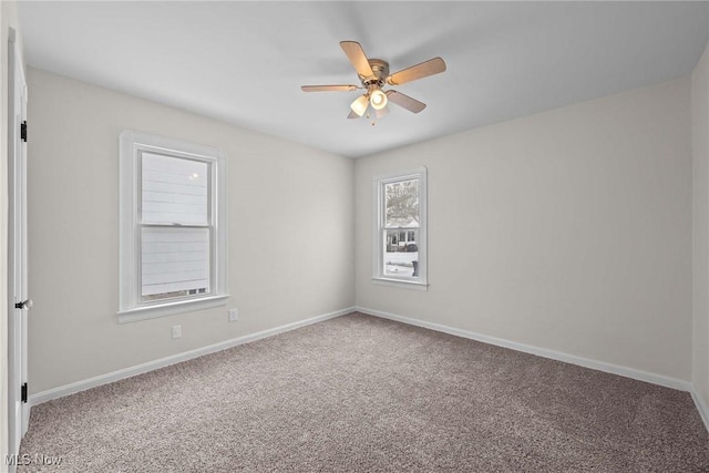 carpeted empty room with ceiling fan