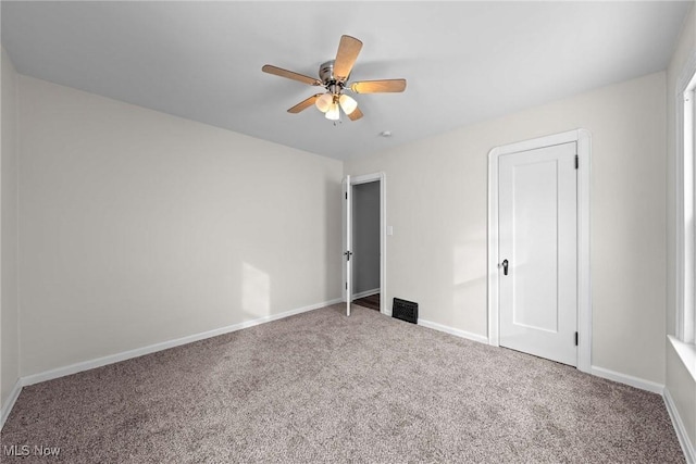 unfurnished bedroom with carpet flooring and ceiling fan