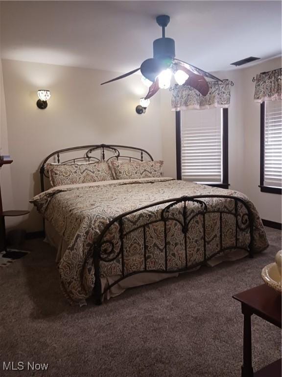 carpeted bedroom featuring ceiling fan