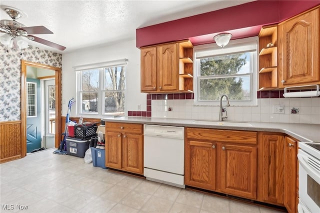 kitchen with ceiling fan, white appliances, sink, and decorative backsplash