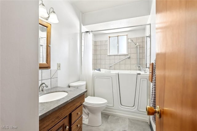 full bathroom featuring vanity, tasteful backsplash, toilet, and shower / bathtub combination with curtain