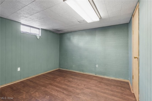 spare room with wood-type flooring