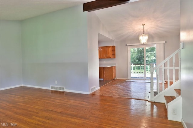 unfurnished living room featuring vaulted ceiling with beams, a chandelier, and dark hardwood / wood-style flooring