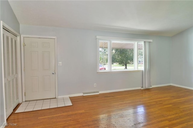 spare room featuring light wood-type flooring