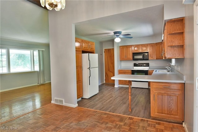 kitchen with sink, white refrigerator, ceiling fan, kitchen peninsula, and stainless steel electric range