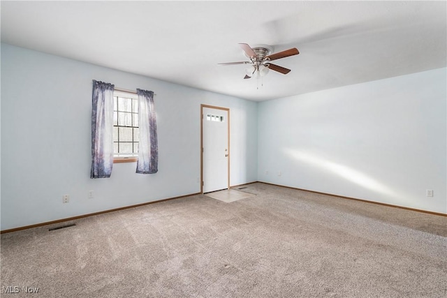 carpeted empty room with ceiling fan