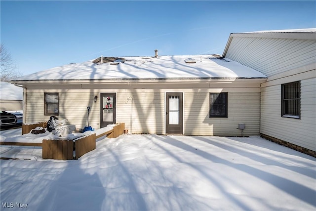 view of snow covered house