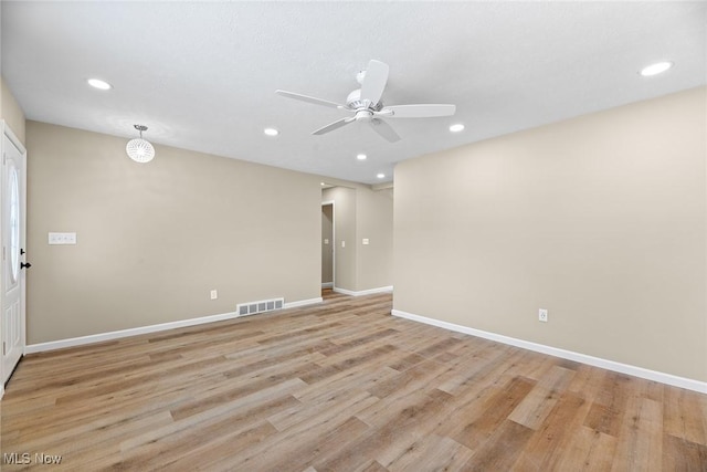 spare room with ceiling fan and light hardwood / wood-style flooring