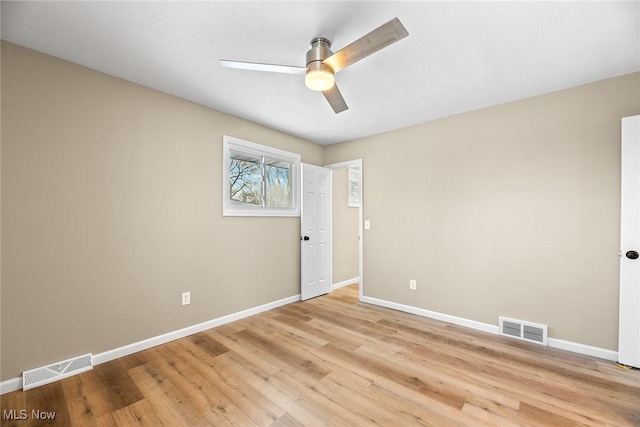 unfurnished room with light hardwood / wood-style floors and ceiling fan