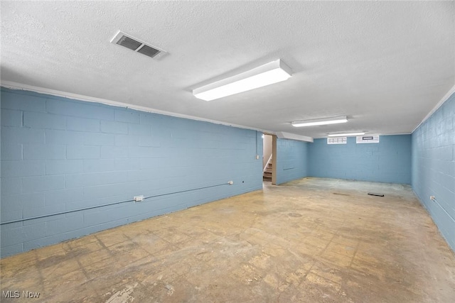 basement with a textured ceiling