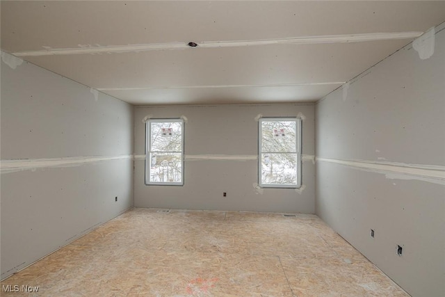 spare room featuring a wealth of natural light