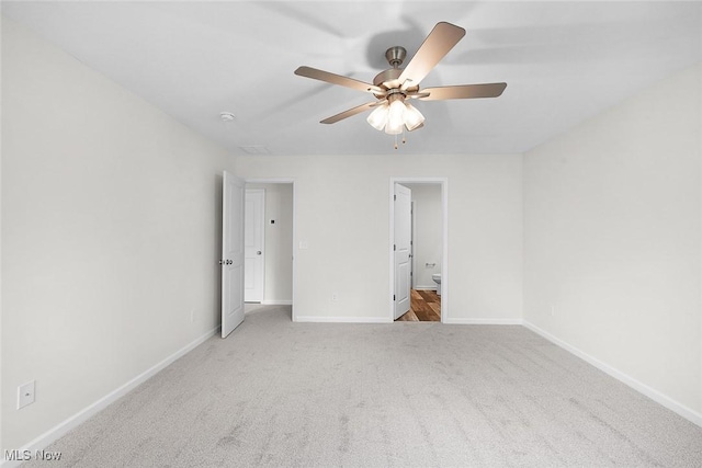 24326 Mastick Rd, North Olmsted, OH 44070 - unfurnished bedroom with carpet floors, baseboards, ensuite bath, and a ceiling fan