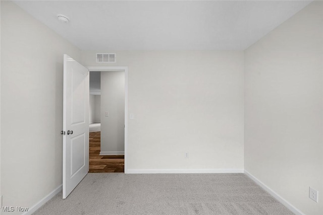 24326 Mastick Rd, North Olmsted, OH 44070 - unfurnished room featuring light colored carpet, baseboards, and a smoke detector