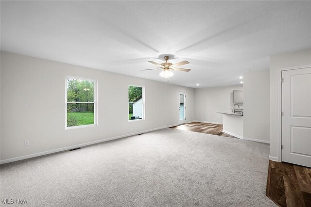 24326 Mastick Rd, North Olmsted, OH 44070 - empty room with dark colored carpet, a ceiling fan, baseboards, and recessed lighting